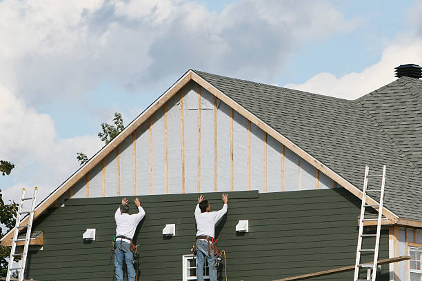 Professional Siding Contractor technician working in Oakland Mills, PA